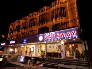a hotel gateway building at night with a neon sign at Hotel Gateway Shillong in Shillong