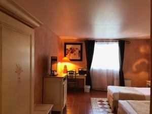 Postel nebo postele na pokoji v ubytování Hotel Le Cilaos