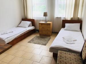 Posteľ alebo postele v izbe v ubytovaní Dusan Apartments