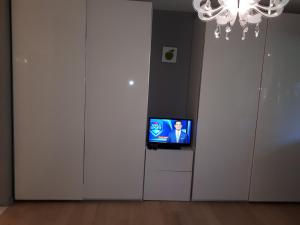 TV a/nebo společenská místnost v ubytování B&B Uccle