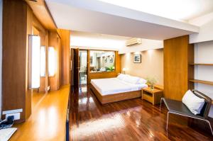 Cama o camas de una habitación en Laemtong Serviced Apartment