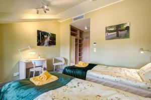 Posteľ alebo postele v izbe v ubytovaní Ratusz B&B