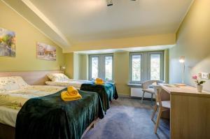 Posteľ alebo postele v izbe v ubytovaní Ratusz B&B