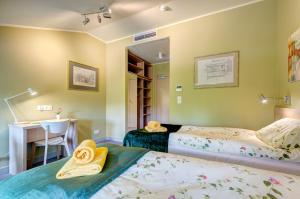 Posteľ alebo postele v izbe v ubytovaní Ratusz B&B