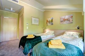 Posteľ alebo postele v izbe v ubytovaní Ratusz B&B