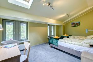 Posteľ alebo postele v izbe v ubytovaní Ratusz B&B