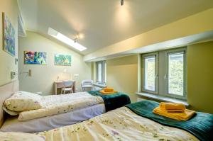 Posteľ alebo postele v izbe v ubytovaní Ratusz B&B