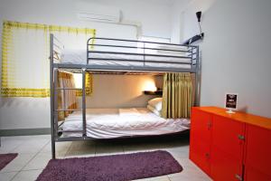 Voodi või voodid majutusasutuse Navel Orange Hostel toas