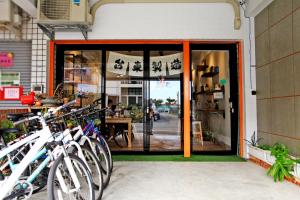 a group of bikes parked outside of a store at Navel Orange Hostel in Taitung City