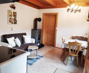 a living room with a couch and a table at Ferienwohnungen Wilhelmer in Liesing