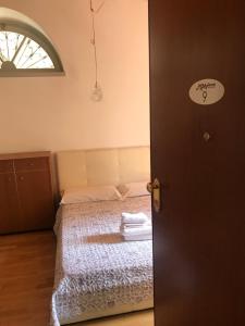 Postel nebo postele na pokoji v ubytování MyRoom Città Alta 1