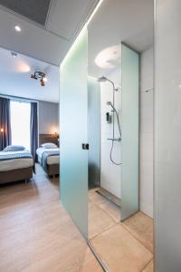 Postel nebo postele na pokoji v ubytování Melrose Hotel