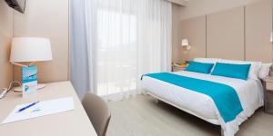 Postel nebo postele na pokoji v ubytování Hotel & Spa Peñiscola Palace