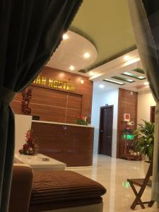 a lobby with a reception desk in a building at Motel Trần Nguyễn in Lagi