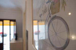a drawing of a bicycle on a wall at Centro A Casuzza in Palermo