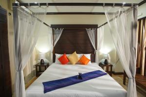 Кровать или кровати в номере Sunny V Hotel