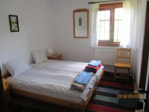 A bed or beds in a room at Borimechkova Kashta