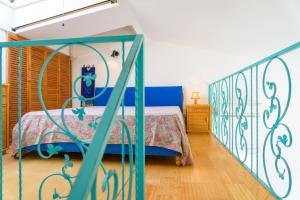 En eller flere senge i et værelse på Appartamento Poggio al Sole