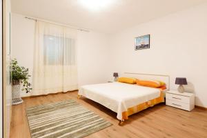 Postel nebo postele na pokoji v ubytování Apartman Lastavica