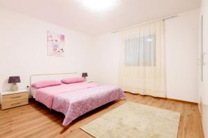 Postel nebo postele na pokoji v ubytování Apartman Lastavica