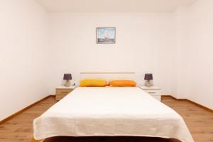 Postel nebo postele na pokoji v ubytování Apartman Lastavica