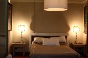 A bed or beds in a room at Le Margherite