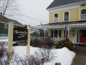 a sign in the snow in front of a house at Kearsarge Inn in North Conway