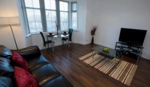 אזור ישיבה ב-Aberdeen Serviced Apartments - The Lodge