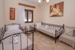 Katil atau katil-katil dalam bilik di Marika Traditional Home