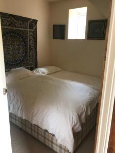a bedroom with two beds and a window at The Annexe Croughton in Banbury +6 photos