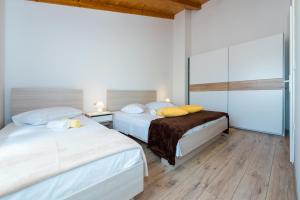 Postel nebo postele na pokoji v ubytování Guesthouse Miranda NP Krka