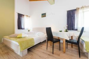 Postel nebo postele na pokoji v ubytování Guesthouse Miranda NP Krka