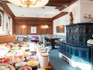 a long table filled with plates of food at Hotel Restaurant Krehl's Linde in Stuttgart