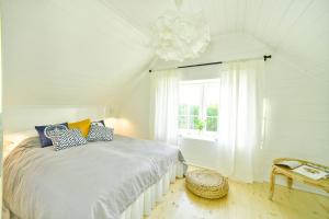 Postel nebo postele na pokoji v ubytování Bla Marine Domki nad Morzem