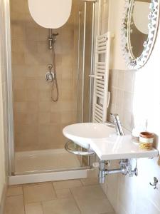 a bathroom with a sink and a shower at Buonanotte Margherita in Taranto +15 photos
