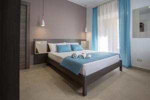 Tempat tidur dalam kamar di Casa dell'Aromatario b&b