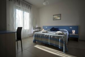 Postel nebo postele na pokoji v ubytování B&B Z'Angelina