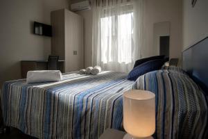 Postel nebo postele na pokoji v ubytování B&B Z'Angelina