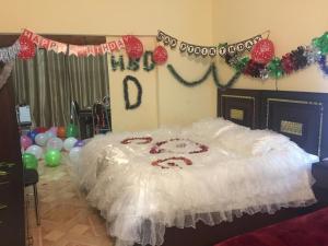 Voodi või voodid majutusasutuse Isra Hotel toas