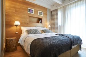 Un pat sau paturi într-o cameră la Relais Villa Miraglia