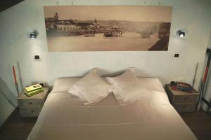 A bed or beds in a room at Relais Ristori