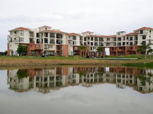 a row of apartment buildings next to a body of water at Vista Mar in San Carlos