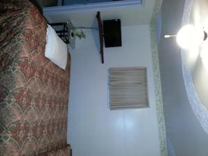 Postel nebo postele na pokoji v ubytování Holiday Motel