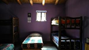 Divstāvu gulta vai divstāvu gultas numurā naktsmītnē Casa Colores