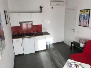 Kuchyň nebo kuchyňský kout v ubytování Accomodation Libertino