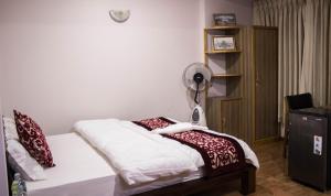 Postel nebo postele na pokoji v ubytování k2Homes