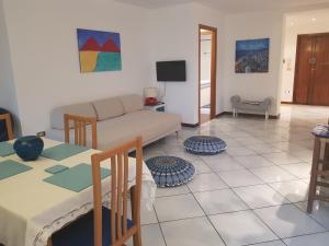 a living room with a couch and a table at La Casa Degli Ospiti in Naples