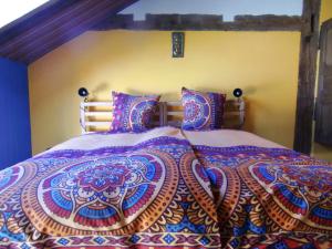 Een bed of bedden in een kamer bij Chambre&Table d'hotes PtitMonde