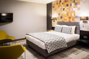 Postel nebo postele na pokoji v ubytování IBB Hotel Gdańsk