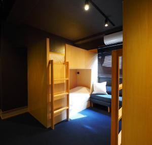 Postel nebo postele na pokoji v ubytování Yumoto Station Hotel MIRAHAKONE